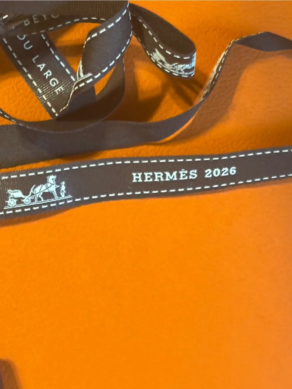 Hermes gift wrap items: gift bag, two ribbons, card insert/recipt holder
